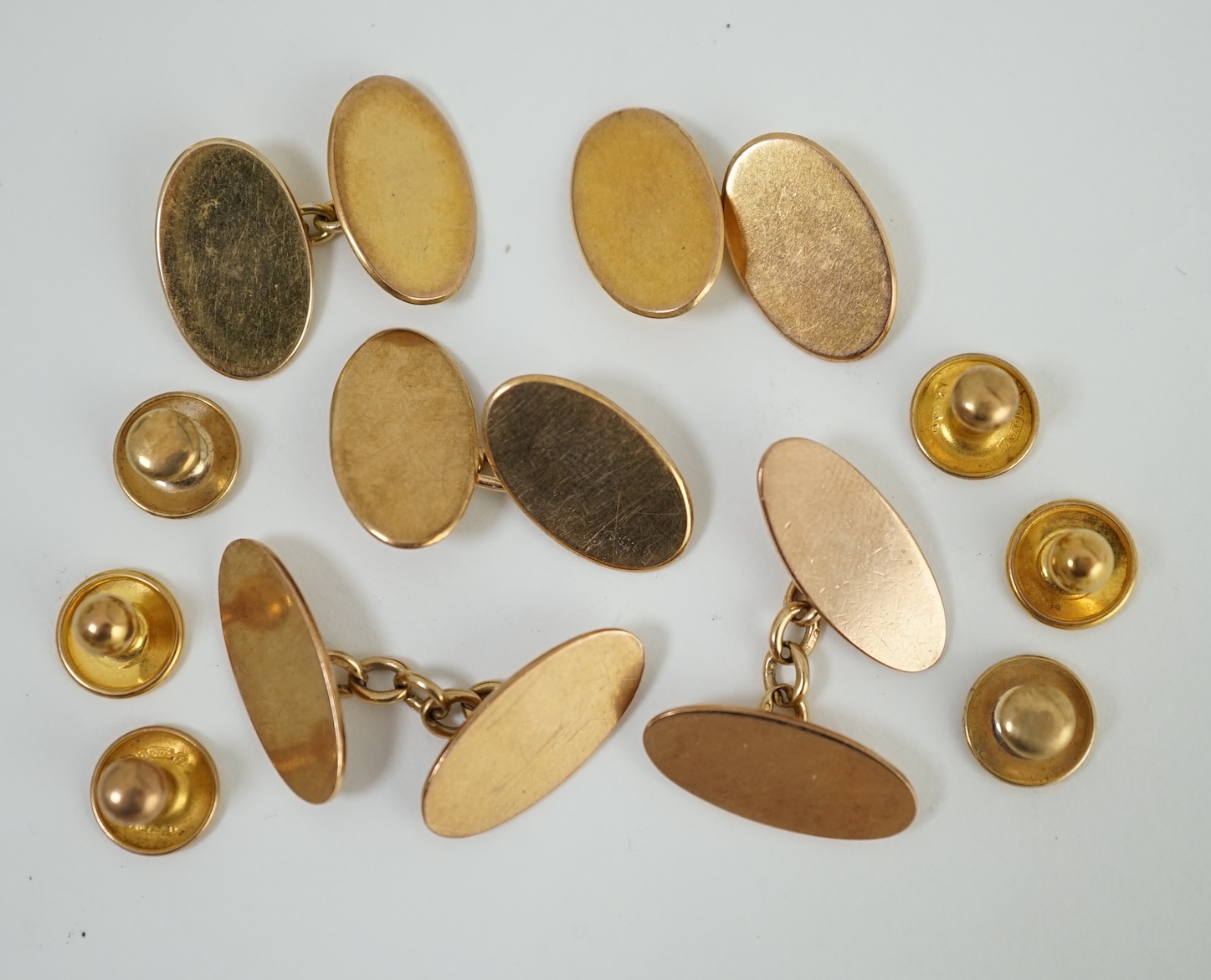 Two pairs of 9ct gold oval cufflinks, one other 9ct gold cufflink and six assorted 9ct dress studs